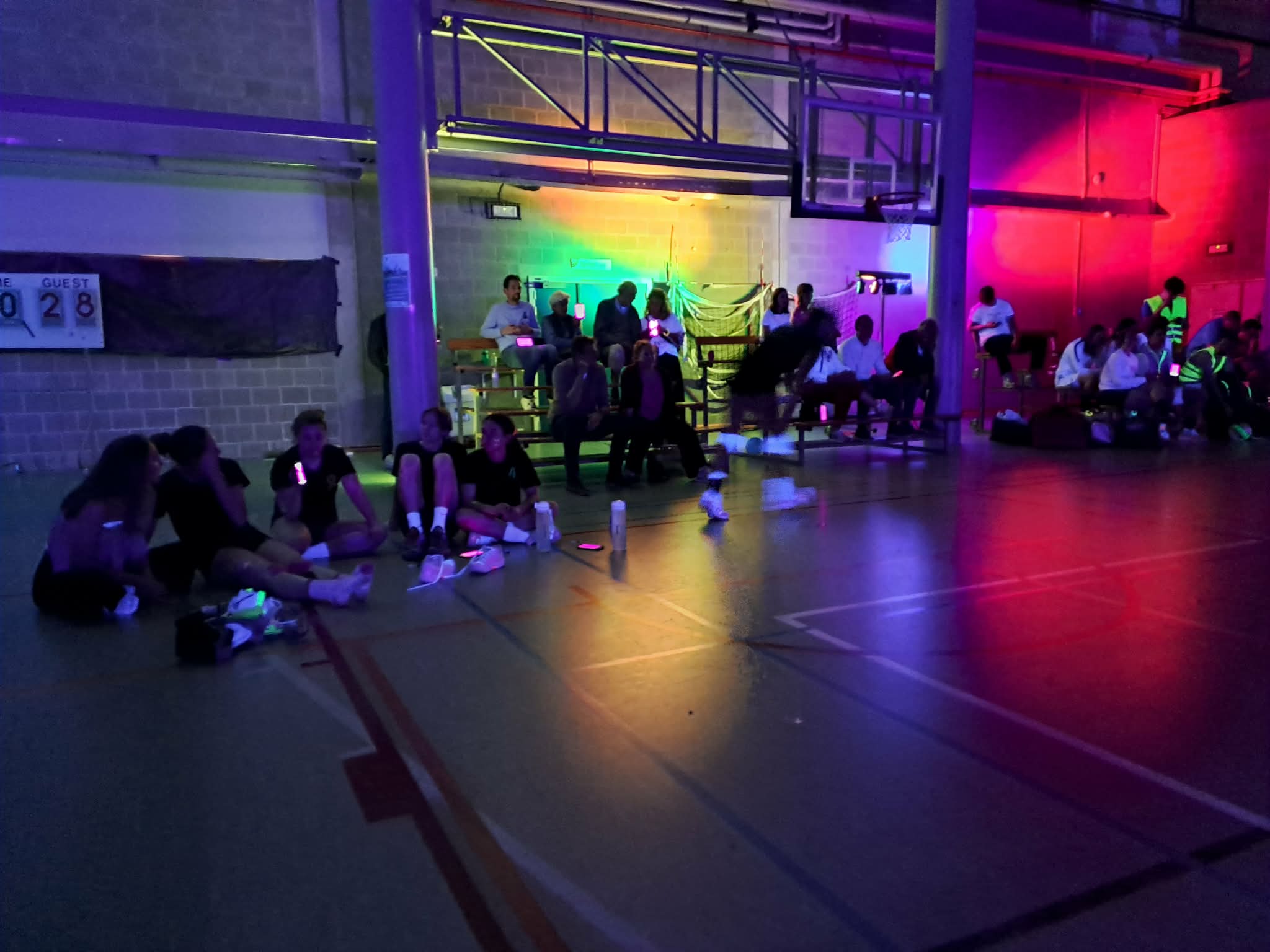 Audience during the EEVOC blacklight event with smartphone pixels